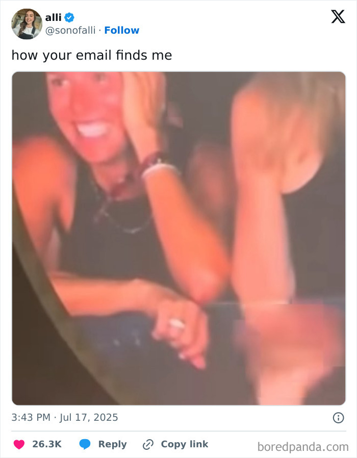 Two people laughing and smiling at a concert, capturing the Chris Martin CEO affair memes moment.