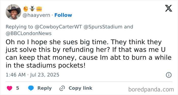 Person wearing a hat and smiling while replying to a tweet about Beyonc&eacute; fan's dehumanizing experience at Cowboy Carter concert.