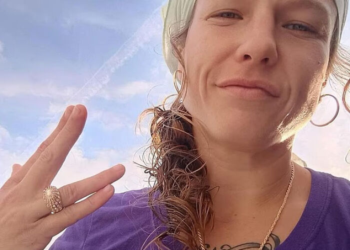 Woman with a confident expression and curly hair posing outdoors, related to woman mysteriously vanished in Death Valley. - 3