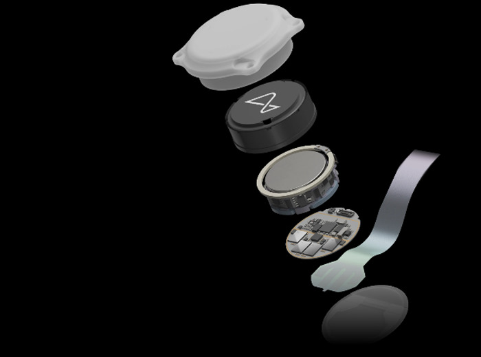 Neuralink brain chip components shown in a layered view against a black background highlighting advanced technology.