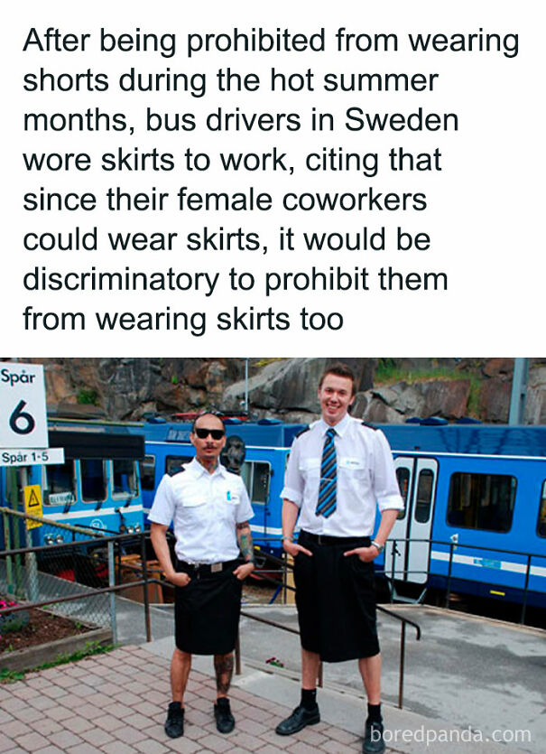 Two bus drivers in Sweden wearing skirts at a train station during summer, funny summer memes about unusual work attire.
