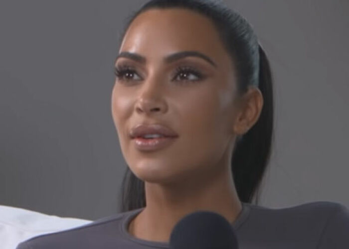Kim Kardashian speaking during an interview, representing the KarJenner clan amid controversies and public attention. - 13