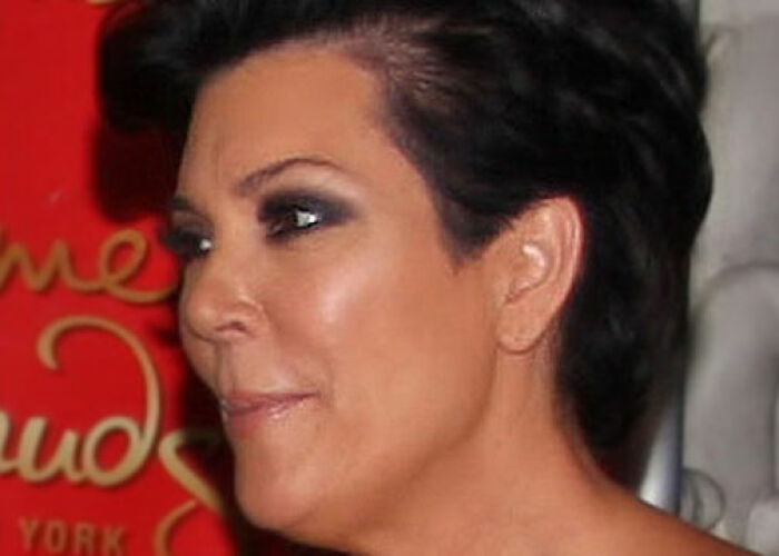 Close-up of a KarJenner clan member with dark hair and makeup, related to the worst things the KarJenner clan has done. - 31