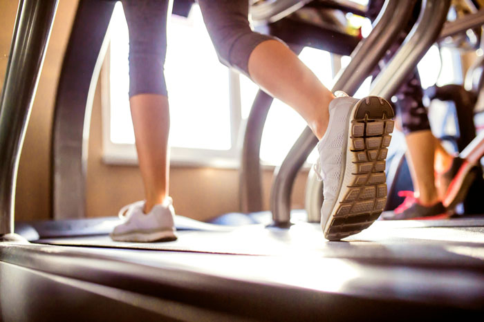 Close-up of a woman walking on a treadmill, symbolizing weight loss medication and fitness efforts in progress. Close-up of a woman walking on a treadmill, symbolizing weight loss medication and fitness efforts in progress.