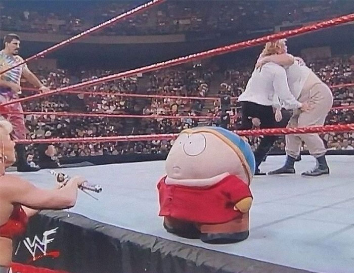 Wrestling ring scene with a Chris Griffin-like character, people in costumes, and a crowd in the background nerdy weird memes style.