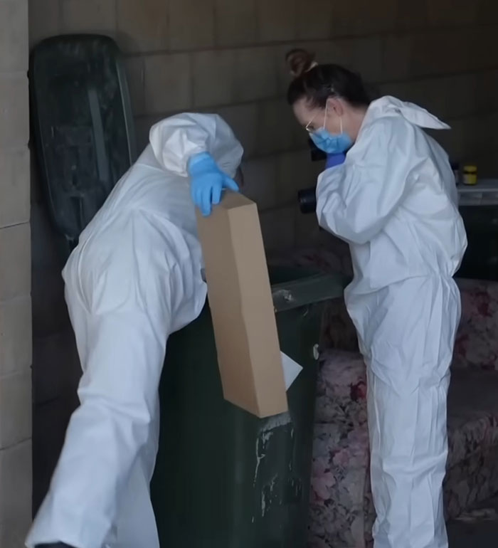Forensic investigators in protective suits examining evidence related to reality star charged with murder case.