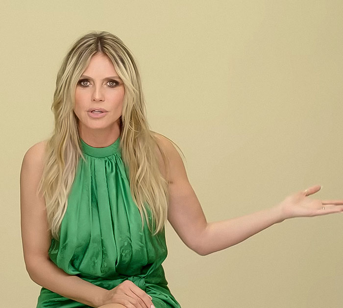 Heidi Klum speaking in a green dress, addressing the controversial lingerie photoshoots with her daughter Leni. - 4
