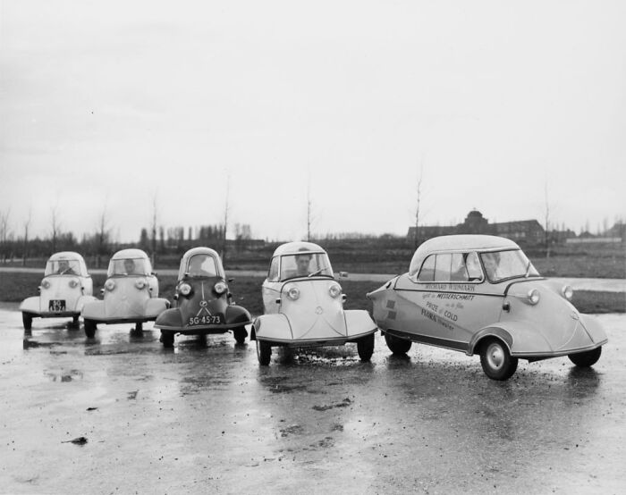 Five rare and interesting historical photographs of unique vintage microcars lined up outdoors on a wet surface.