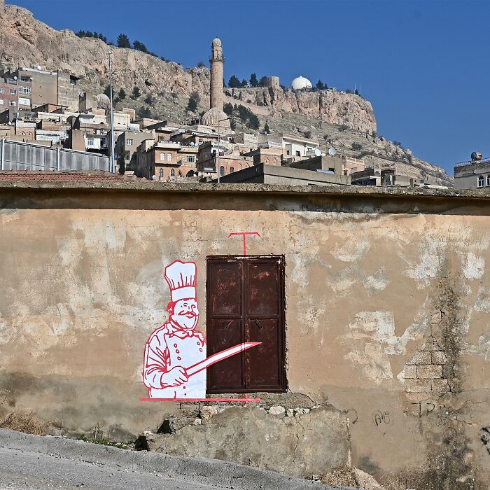 Street art by Frankey creatively transforms a closed brown metal door into a chef holding a large knife.