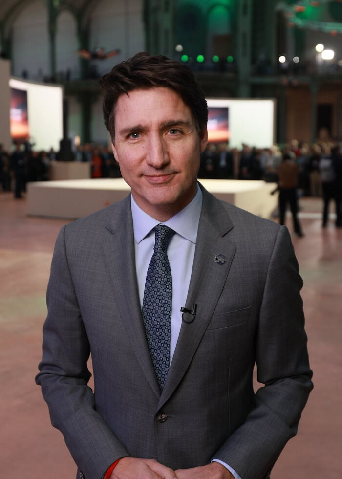 Justin Trudeau in a grey suit at an indoor event sparking Katy Perry and Justin Trudeau romance rumors. Justin Trudeau in a grey suit at an indoor event sparking Katy Perry and Justin Trudeau romance rumors.