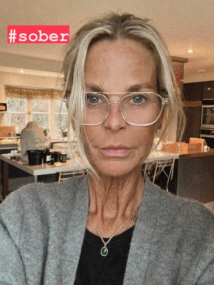 Ulrika Jonsson wearing glasses and a grey cardigan, addressing trolls about her over-tanned face in an emotional post.