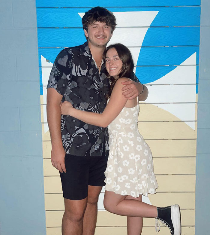 Young couple smiling and hugging outdoors in front of a colorful wall, unrelated to unsealed docs after Bryan Kohberger crime - 9