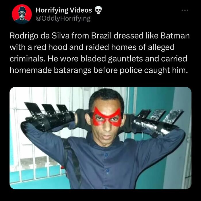 Man dressed like Batman with red hood and bladed gauntlets, an oddly horrifying image of a vigilant raider before arrest.
