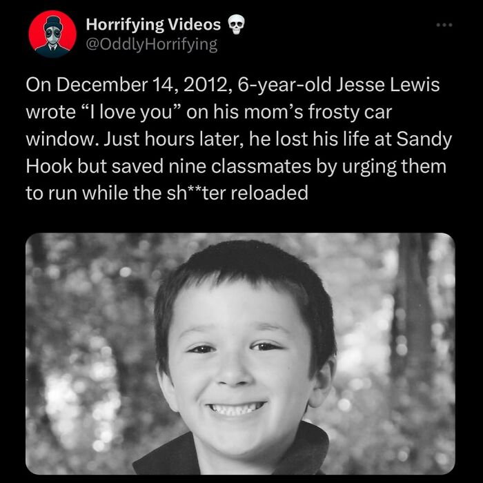 Black and white image of a smiling young boy, related to unnerving and oddly horrifying images that might give nightmares.