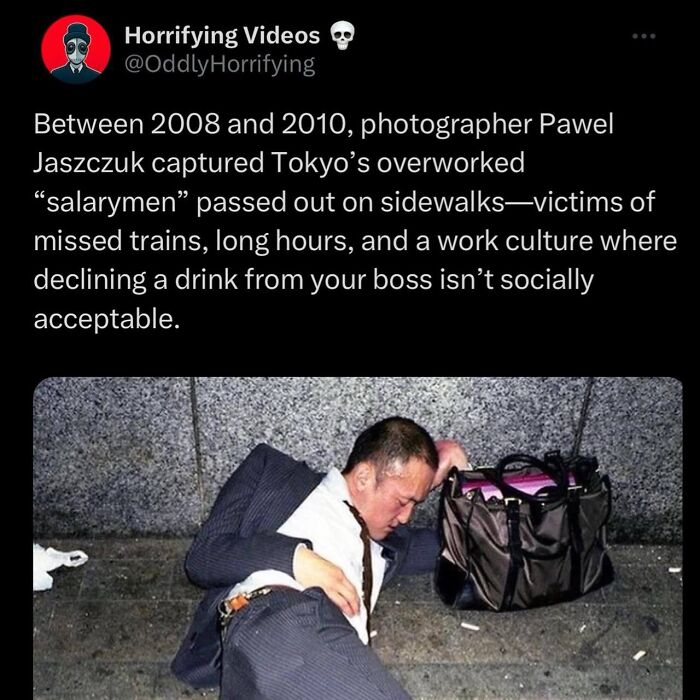 Man in a suit passed out on a sidewalk, depicting oddly horrifying work culture and exhaustion in unnerving urban scenes.