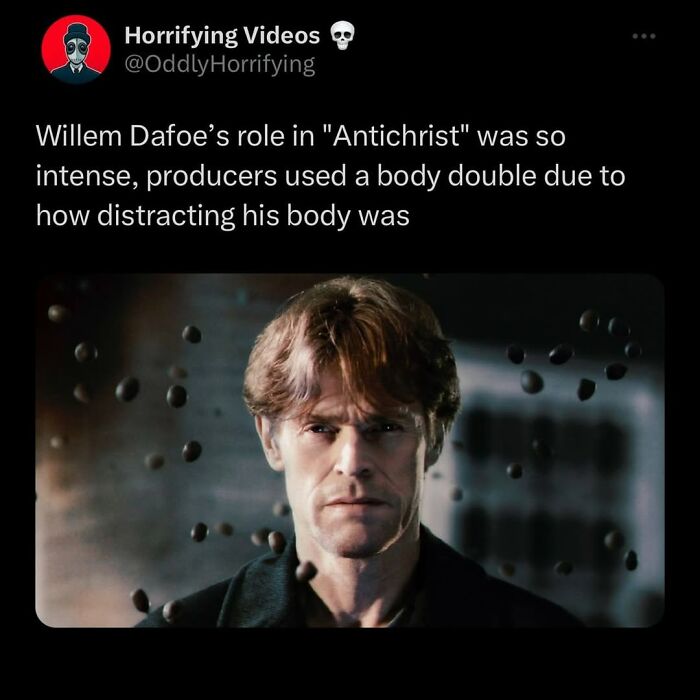 Willem Dafoe in a dark intense scene with floating orbs, showcasing an unnerving and oddly horrifying movie moment.