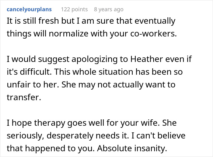 Jealous wife spying husband at work using phone, looking through office window with concerned expression.