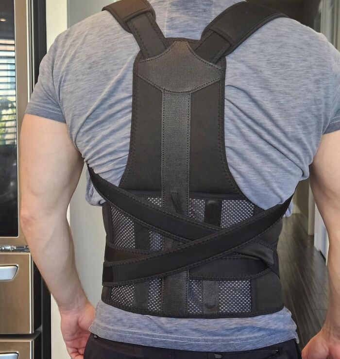 Man wearing a black posture corrector back brace, showcasing one of the 5-star Prime Day finds for support and comfort.