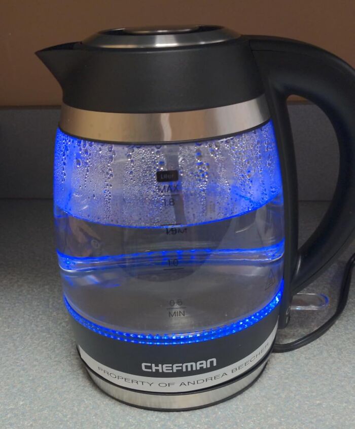 Electric glass kettle with blue LED light boiling water, highlighted as a 5-star Prime Day find for kitchen use.