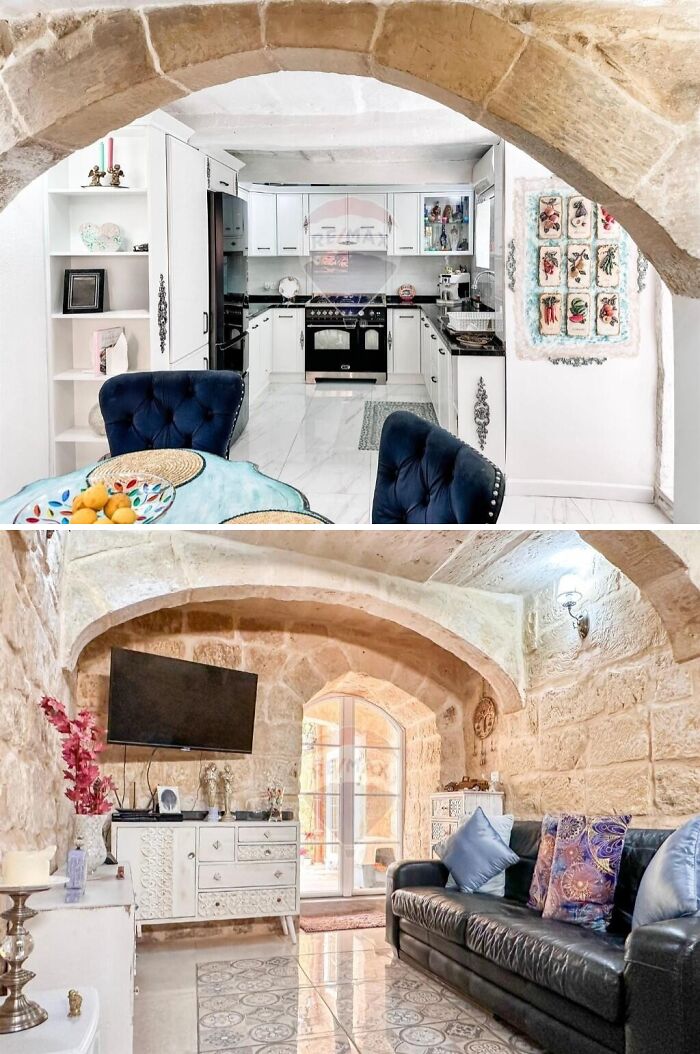 Spacious luxury apartment interior with stone arches, modern kitchen, and comfortable living area in a unique setting.