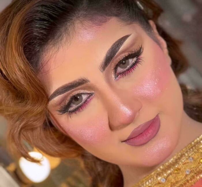 Close-up of a woman with salon makeup highlighting a glow-up transformation and beauty look after a salon visit.