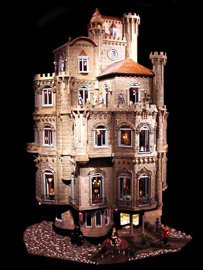 Intricate castle miniature collectible item with detailed figures and architecture, one of the highest-value collectible items sold.