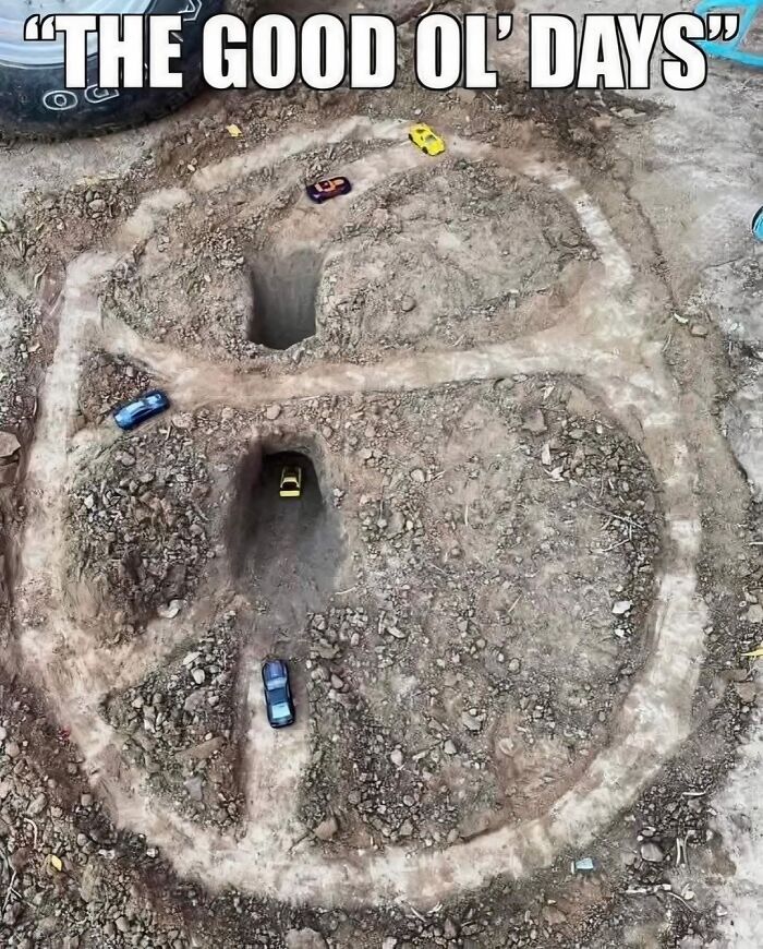 Dirt race track with toy cars driving through tunnels, capturing nostalgic memories of growing up in the ’90s.