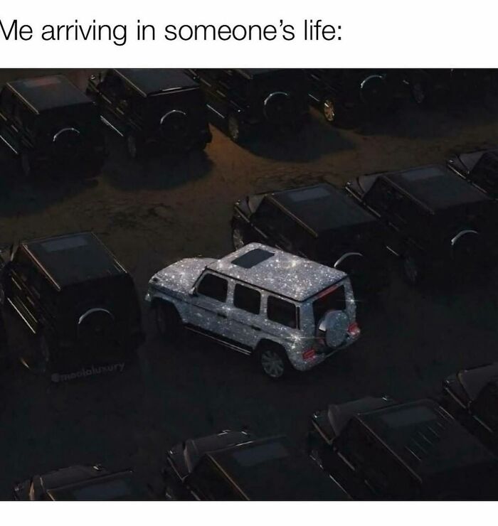 A shiny, glitter-covered car standing out among dark cars, humorously representing girly women arriving in someone's life.
