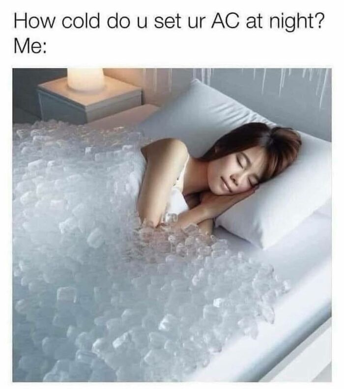 Woman sleeping under a bed covered with ice cubes, illustrating a funny and relatable meme for girly women about cold AC settings.