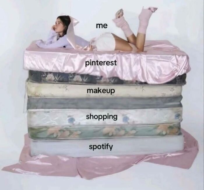 Young woman lying on stacked mattresses labeled Pinterest, makeup, shopping, and Spotify in a funny and relatable girly women meme.