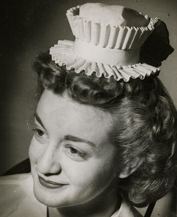 Vintage photo of a nurse wearing a traditional cap, showcasing the timeless healing and hope nurses bring with grace.