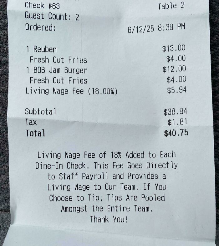 Receipt showing an 18% living wage fee added to a restaurant bill, illustrating ridiculous fees people were mad about.