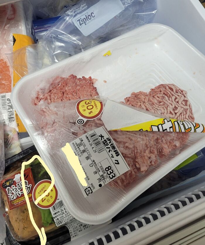 Packaged ground meat slices oddly separated inside the tray, showing a clueless partner’s lack of careful packing.