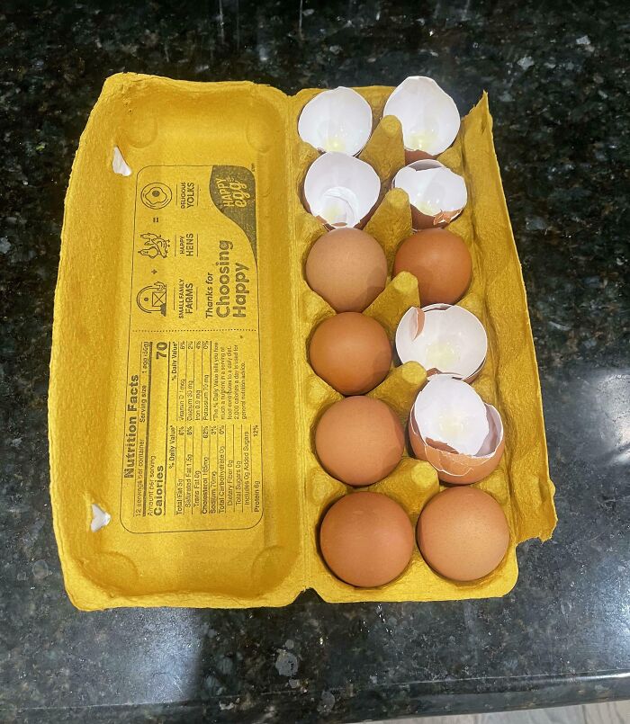 Egg carton with whole eggs and empty eggshells mixed together, illustrating clueless partner mishap from hilarious photos.