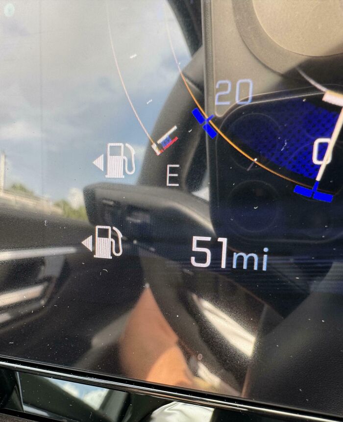 Car dashboard showing empty fuel gauge with 51 miles remaining, illustrating clueless partner mistake.