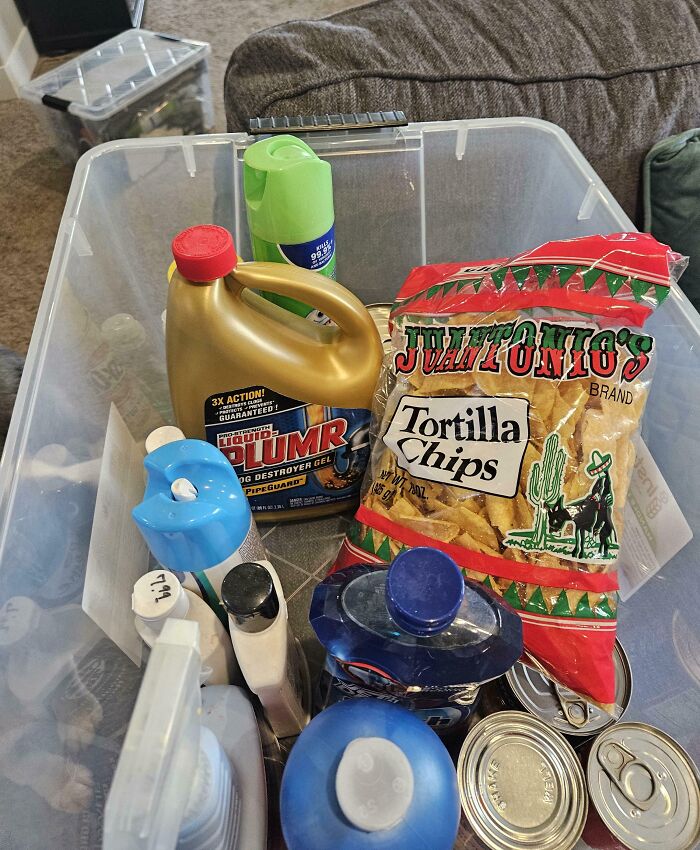 Clear plastic bin with cleaning supplies and a bag of tortilla chips, showcasing clueless partner mix-up humor.