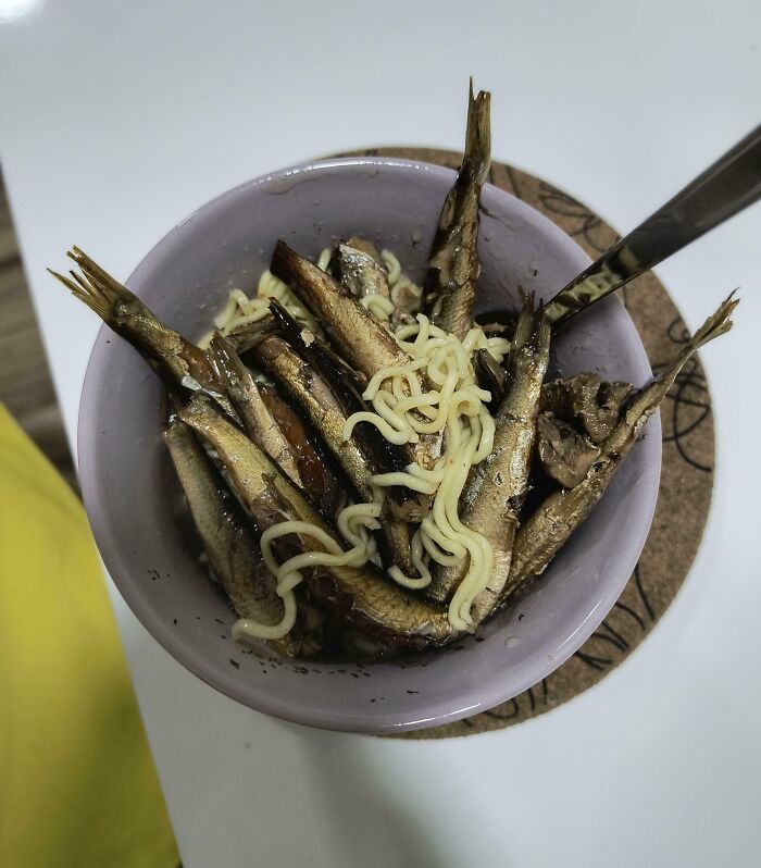 Bowl of fish mixed with noodles illustrating hilarious cluelessness of some people’s partners in food preparation.