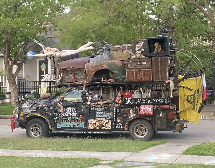 Outrageous car mods featuring a heavily customized truck with eclectic decorations and a rusted car on its roof.