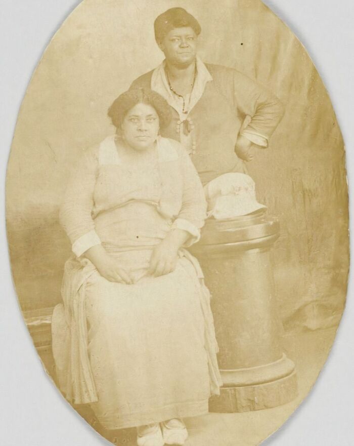 Vintage postcards featuring two women posing in 1930s attire, capturing the heart of the era with sepia tones and period fashion.