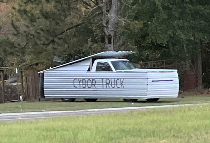 Modified truck covered in metal sheets labeled Cybor Truck, an example of outrageous car mods that took things way too far.