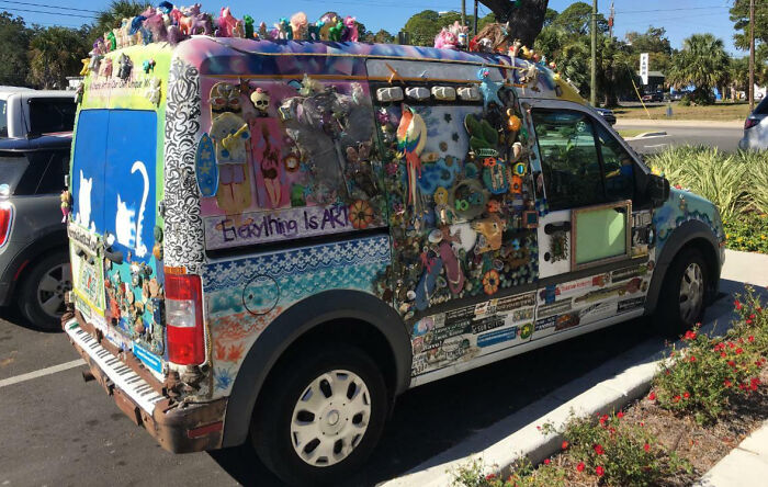 Van covered with colorful decorations and art, an example of outrageous car mods that took customization too far.