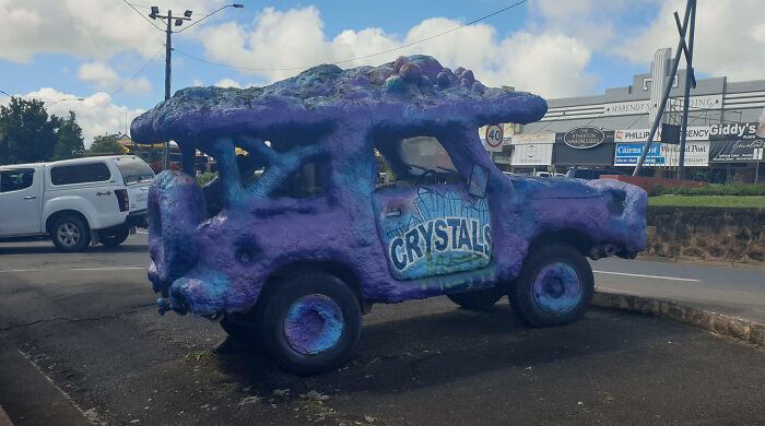Outrageous car mods featuring a purple alligator-shaped vehicle with custom textured paint and unique design elements.