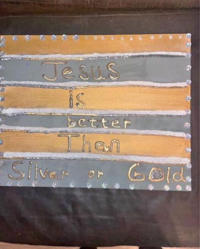 Handmade craft sign with uneven lettering saying Jesus is better than silver or gold, showcasing horrible crafts.