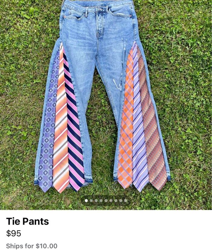 Denim pants with multiple colorful ties sewn along the legs, showcasing a creative but horrible craft on grass.