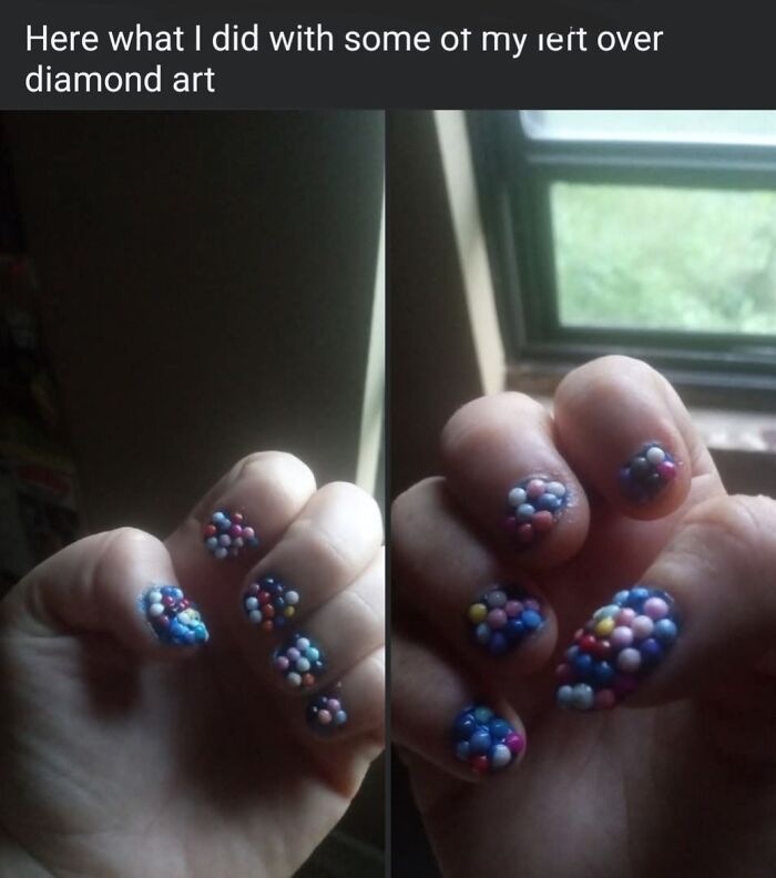 Close-up of a hand with poorly done craft nails decorated with uneven beads showing a horrible craft attempt.