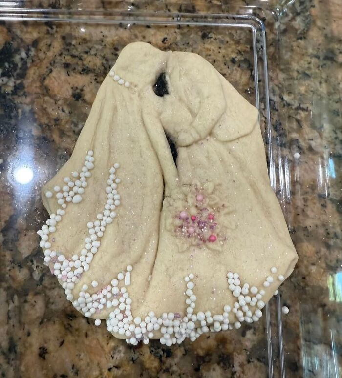 Poorly crafted salt dough sculpture of a bride and groom hugging, showcasing one of the worst horrible crafts made by netizens.