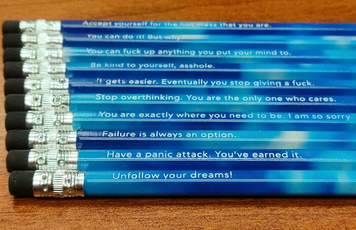 Set of blue pencils with humorous and mildly interesting quotes printed on them, shared for mild interest.