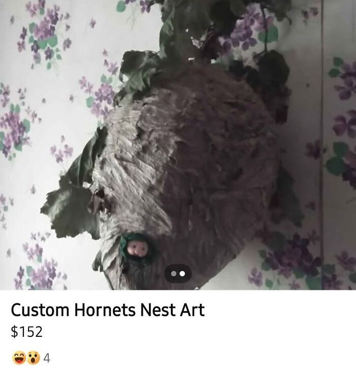 Hornets nest craft hanging on floral wallpaper, an example of horrible crafts shamed by netizens online.