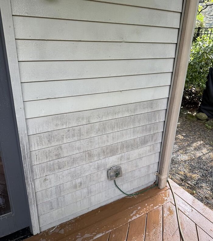 Dirty exterior siding showing the need for cleaning finds to achieve spotless grout lines and surfaces outside a home.