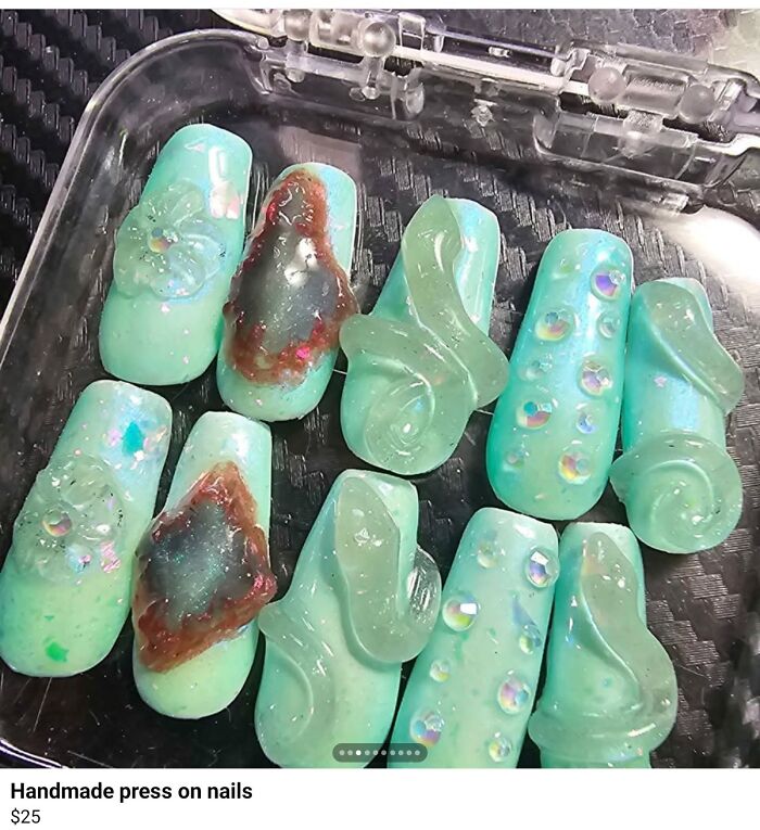 Handmade press-on nails with uneven shapes and shading, showcasing a poorly executed horrible craft design.